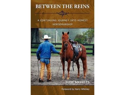 Livro Between the Reins de Tom Moates (Inglês)