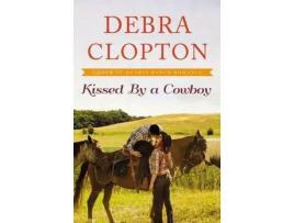 Livro Kissed By A Cowboy de Debra Clopton ( Inglês )